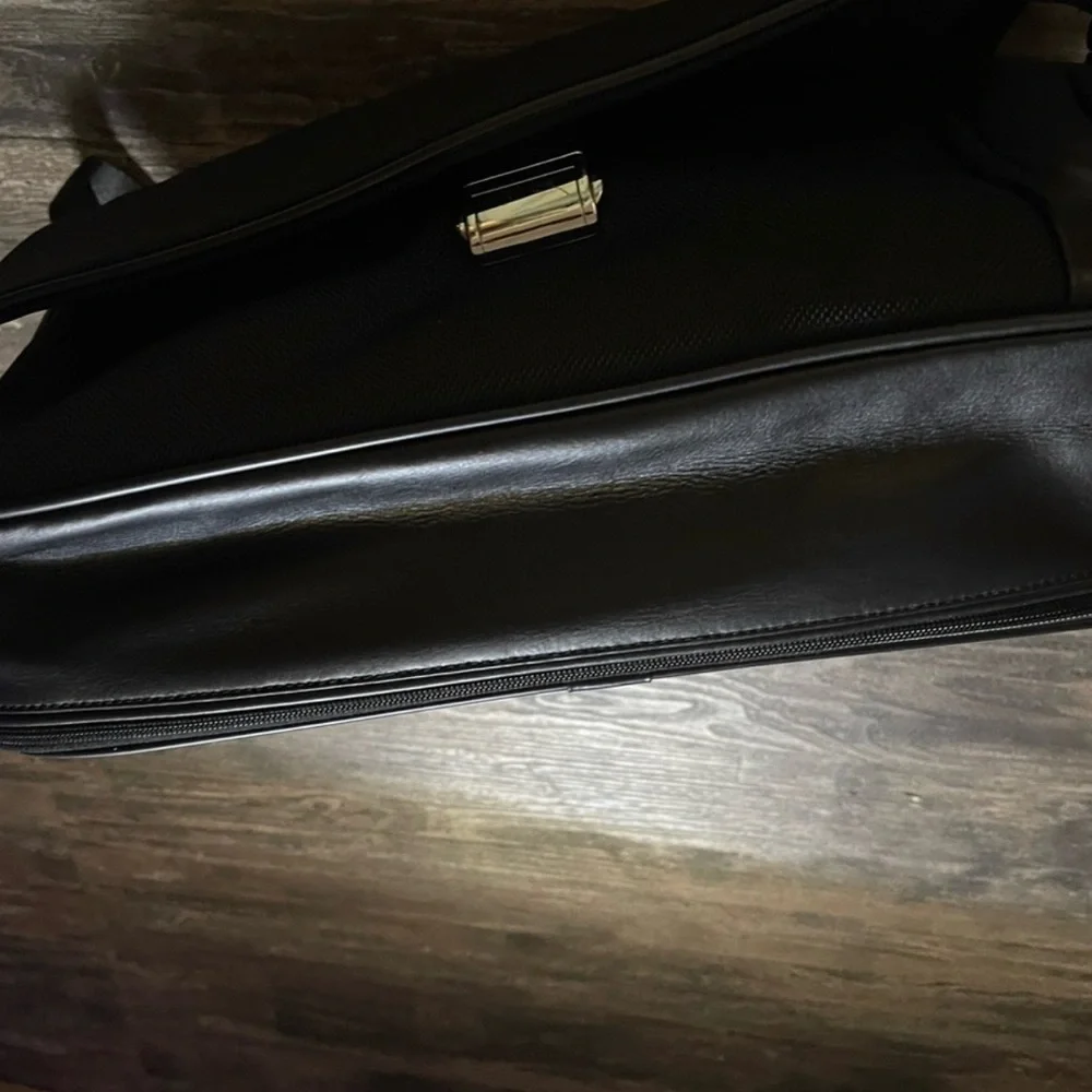 TUMI BRIEFCASE LAPTOP BAG  (zippers in back to attach  suitcase handles)
